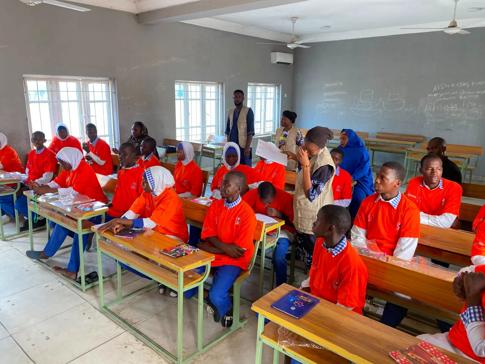 Students seated at classroom desks